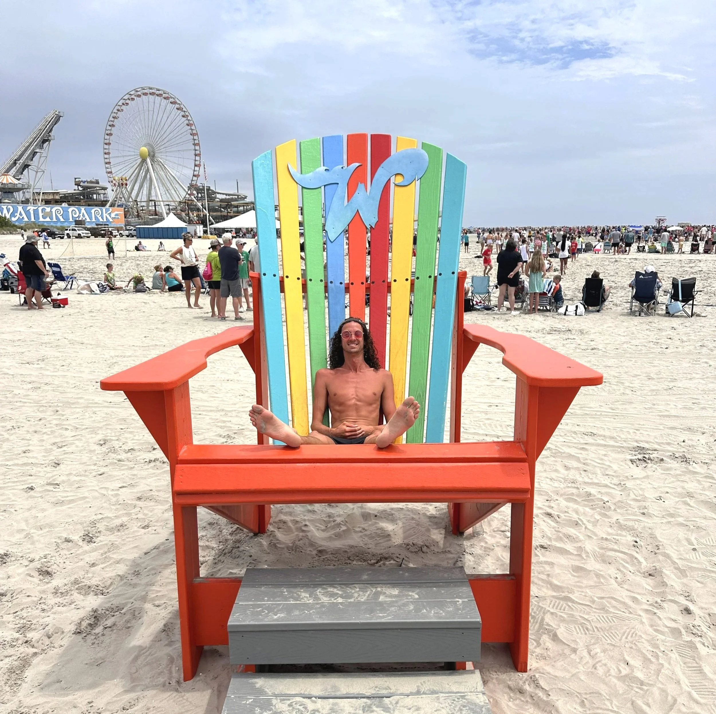 gage sitting in oversized beach chair at wildwood new jersey beach.jpg