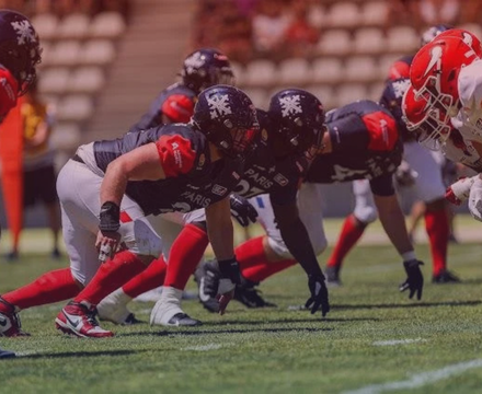 American football players lined up in a formation on the field during a game.