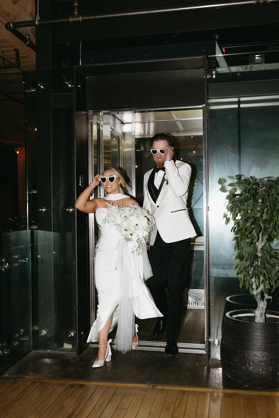 married couple walking out of elevator