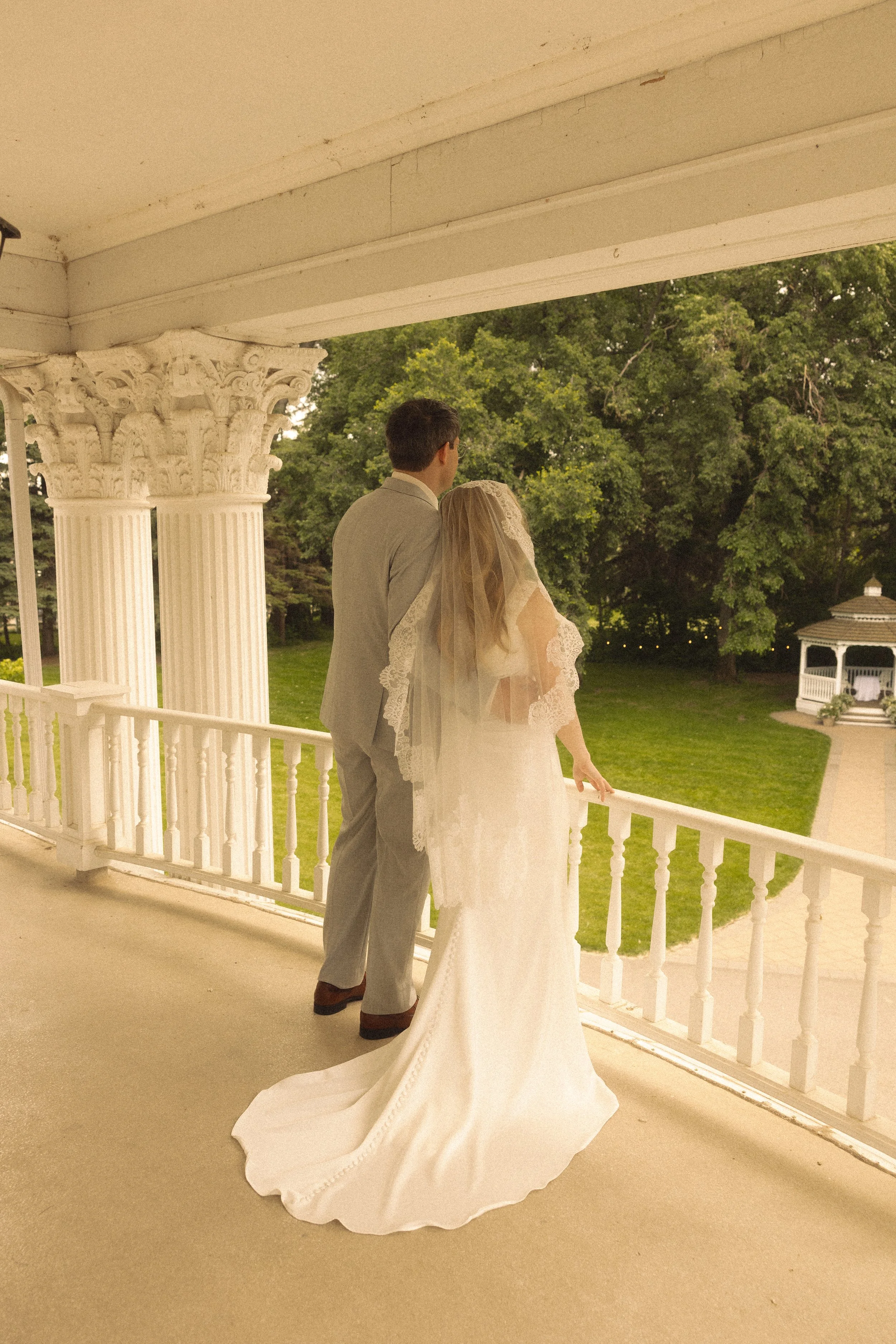 bride and groom at the norland historic estate on the porch