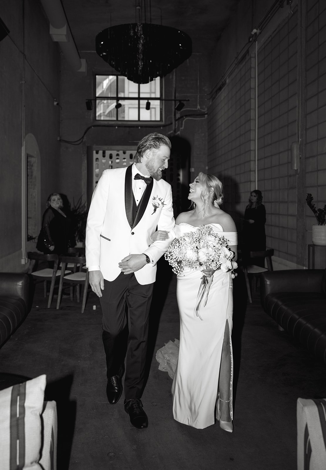 married couple with white rose and babies breath bouquet