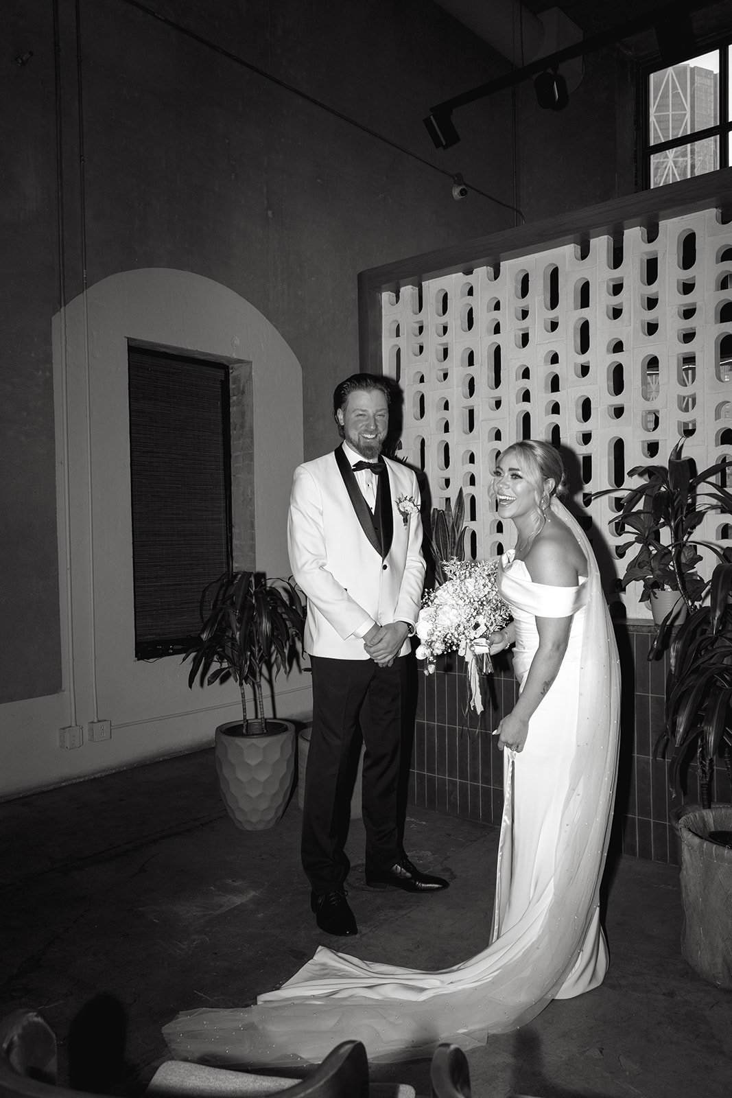 married couple with white rose and babies breath bouquet