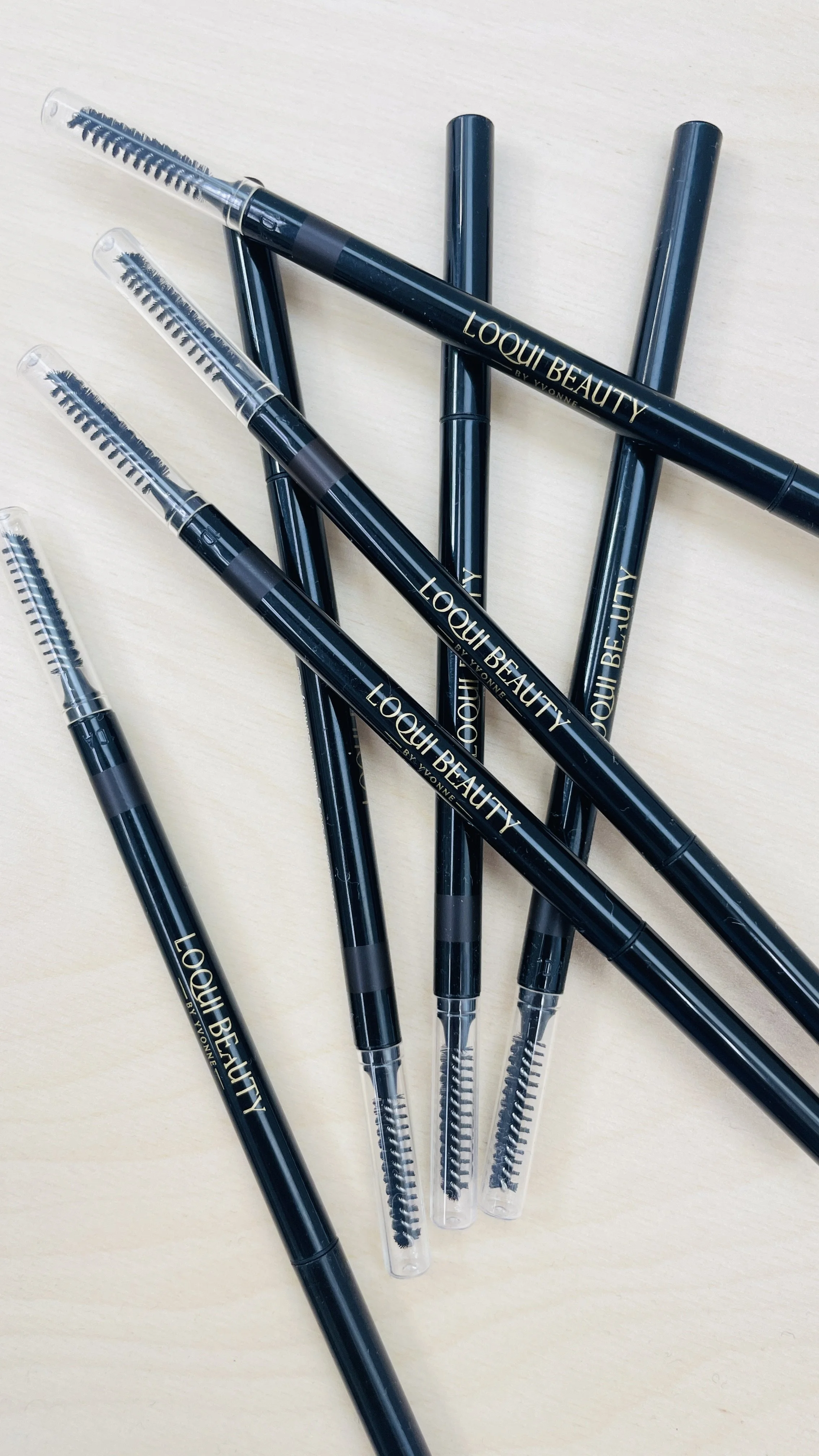 Image of a bunch of loqui beauty brow pencils