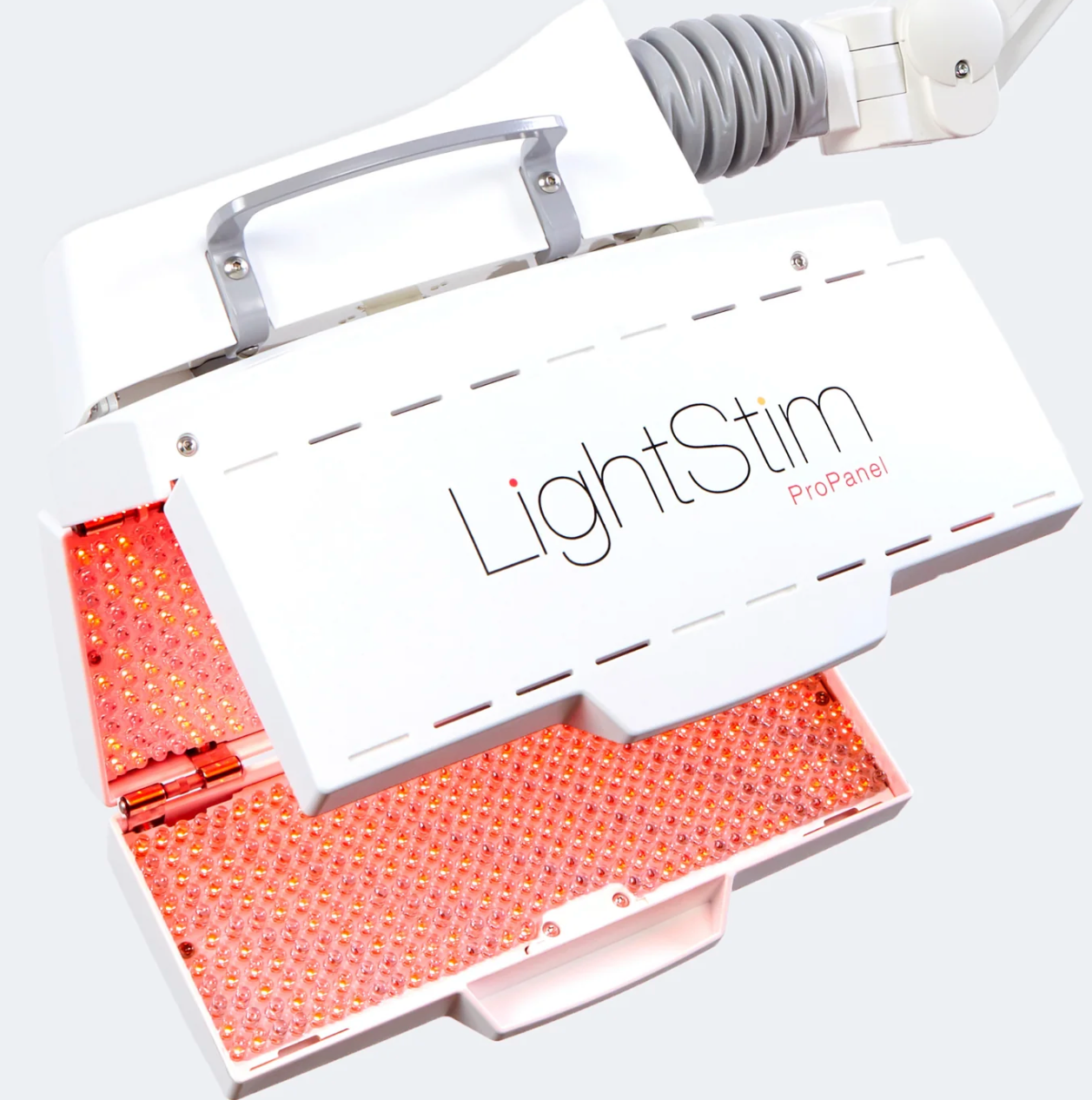 A LightStim ProPanel device with red LED light therapy panels, used for skin treatment, showing the brand name printed on it.