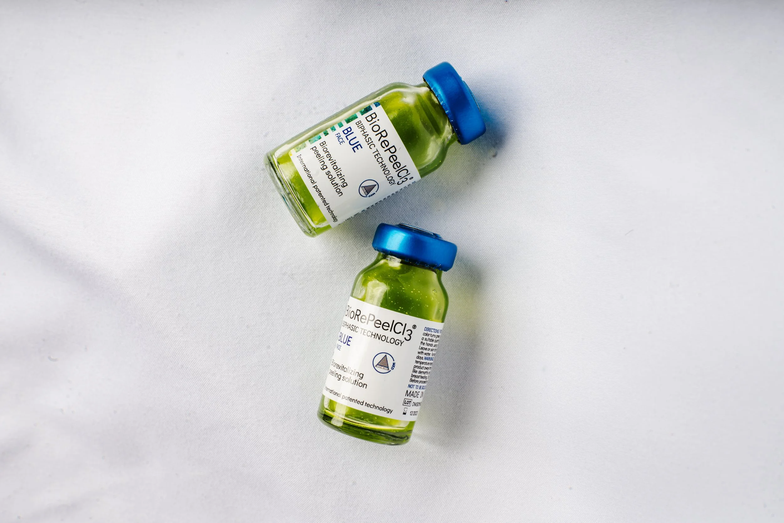 Image of two bottles of BiRePeelCl3