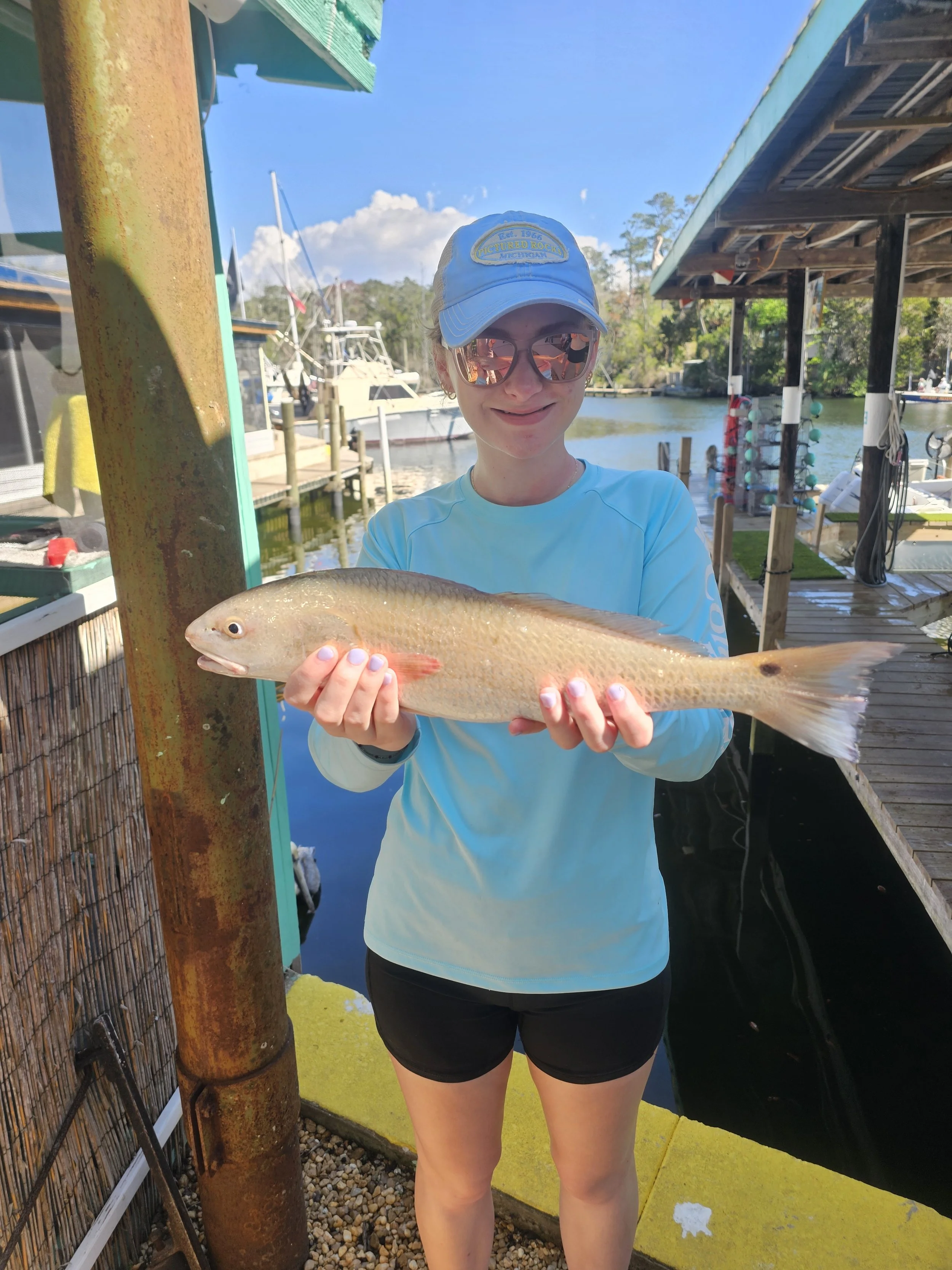 gods country andys gdaughter emily first keeper redfish.jpg