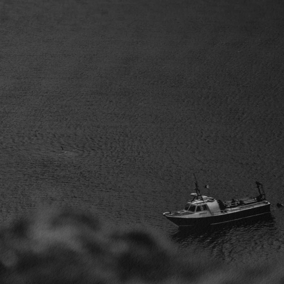Close-up black and white detail of calm sea surface near St Abbs, showing subtle texture and tonal transitions.