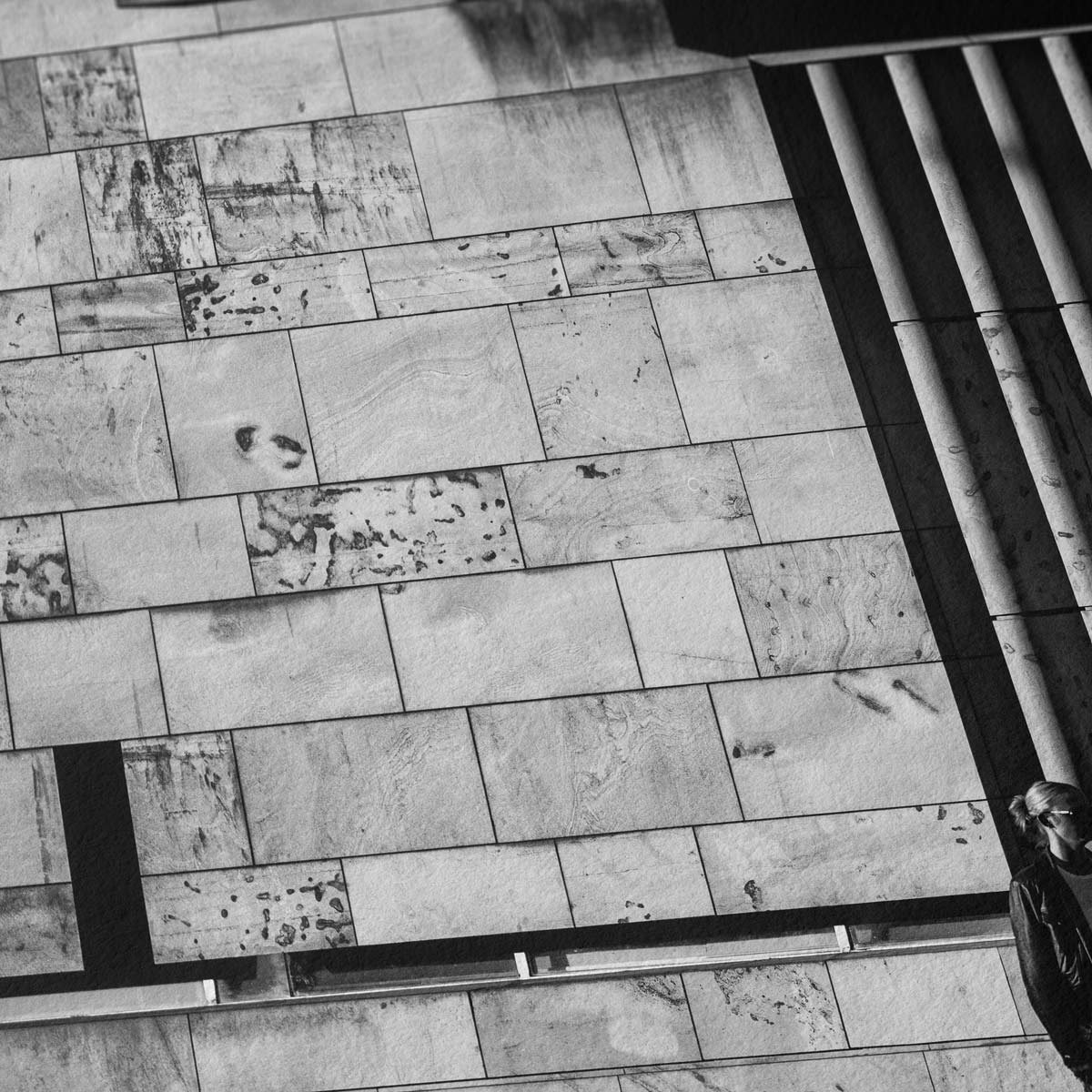 Detail of stone facade and vertical architectural lines in black and white