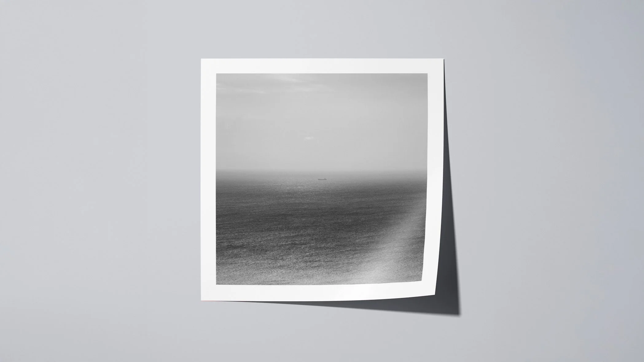 Wide-angle view of a square black and white fine art photography print on matte paper, presented on a neutral background with soft shadow.