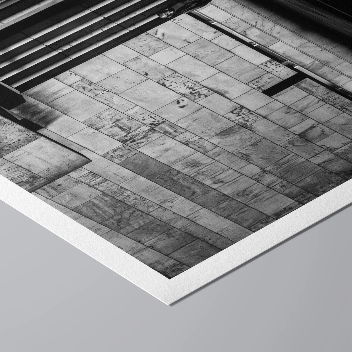 Diagonal composition showing architectural rhythm and movement in a black and white urban photograph