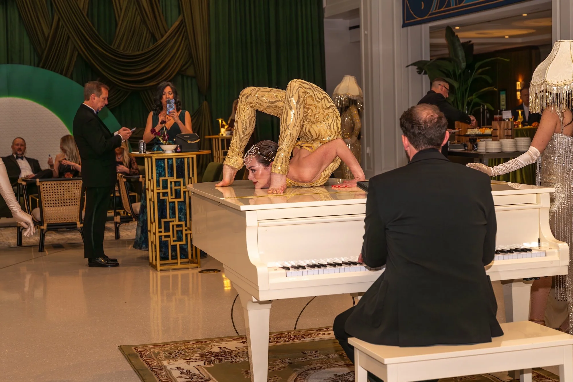 Contortionist performer on a piano