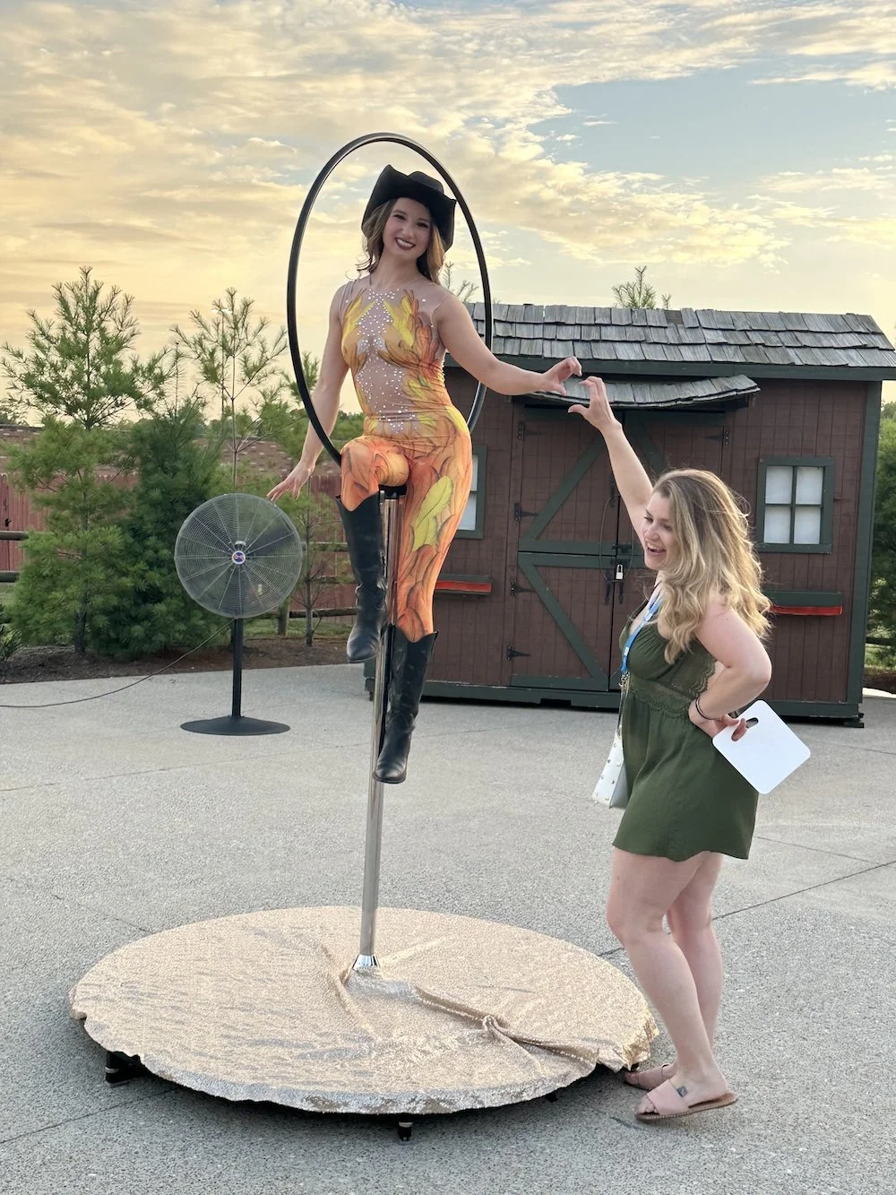 Aerialists on lollipop lyra interacting with guests
