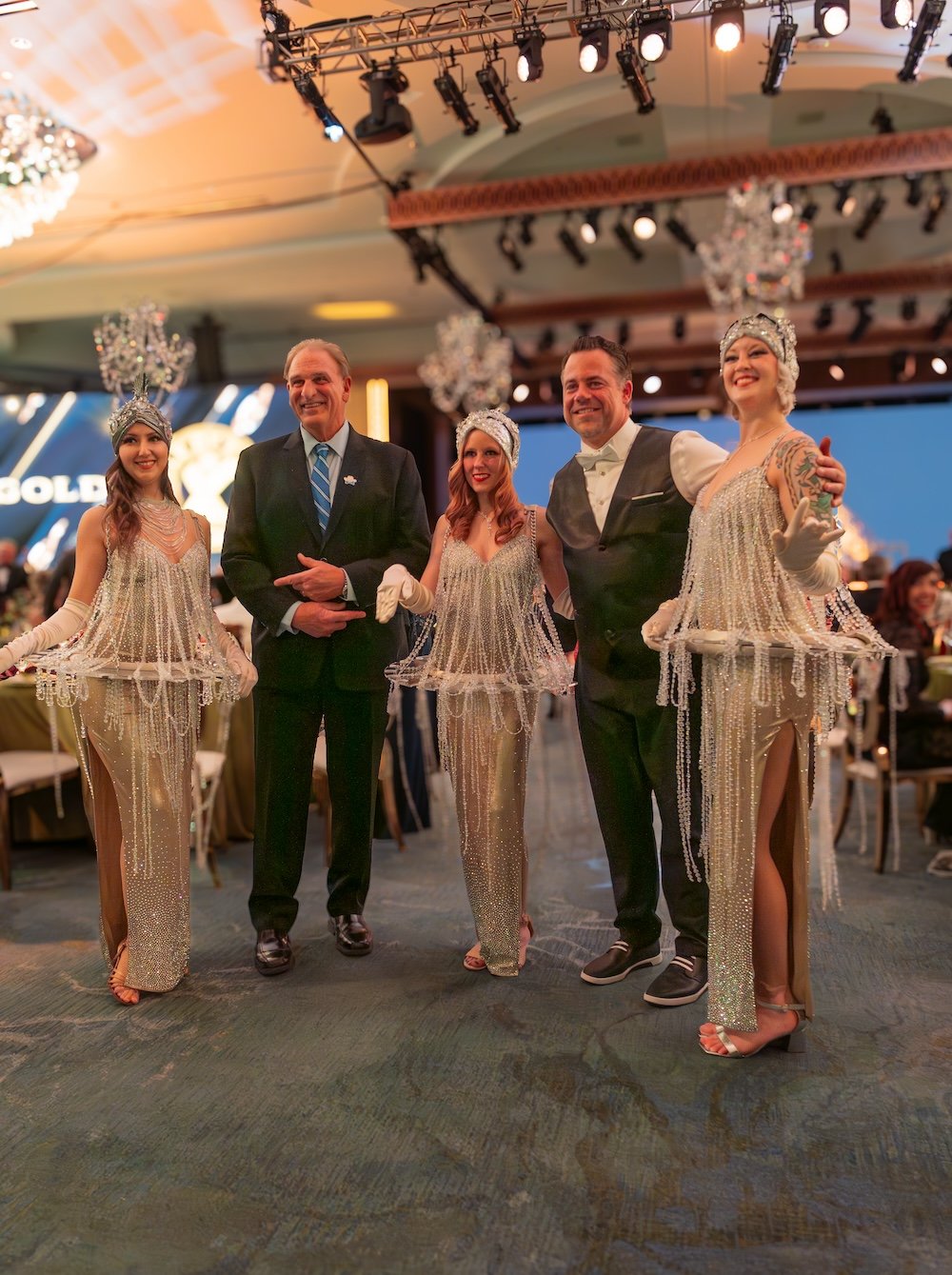 Living Chandelier models pose for photos