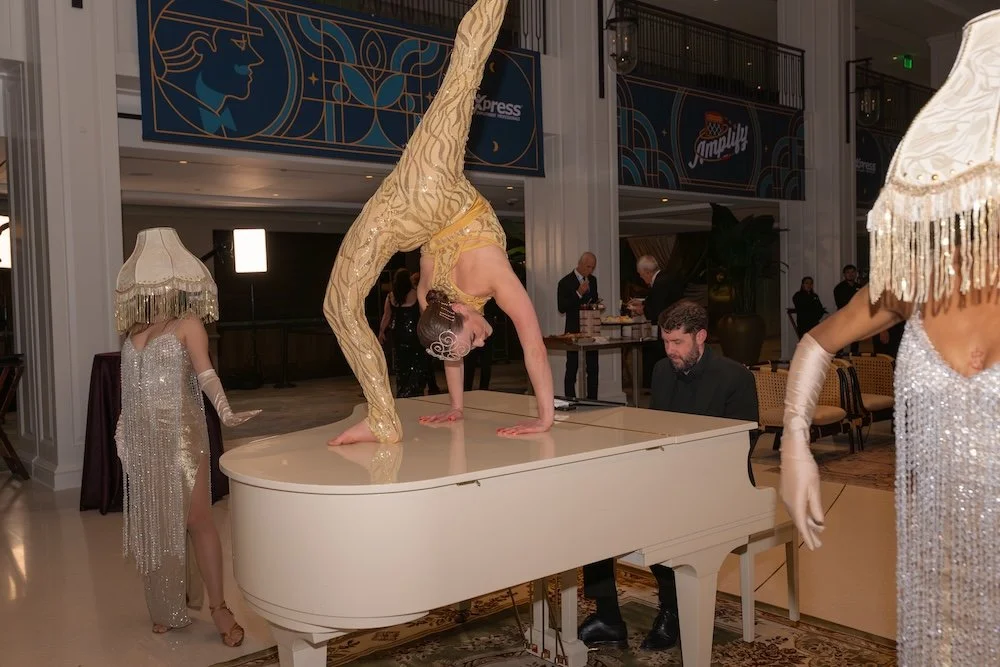 Contortionist on piano at corporate event