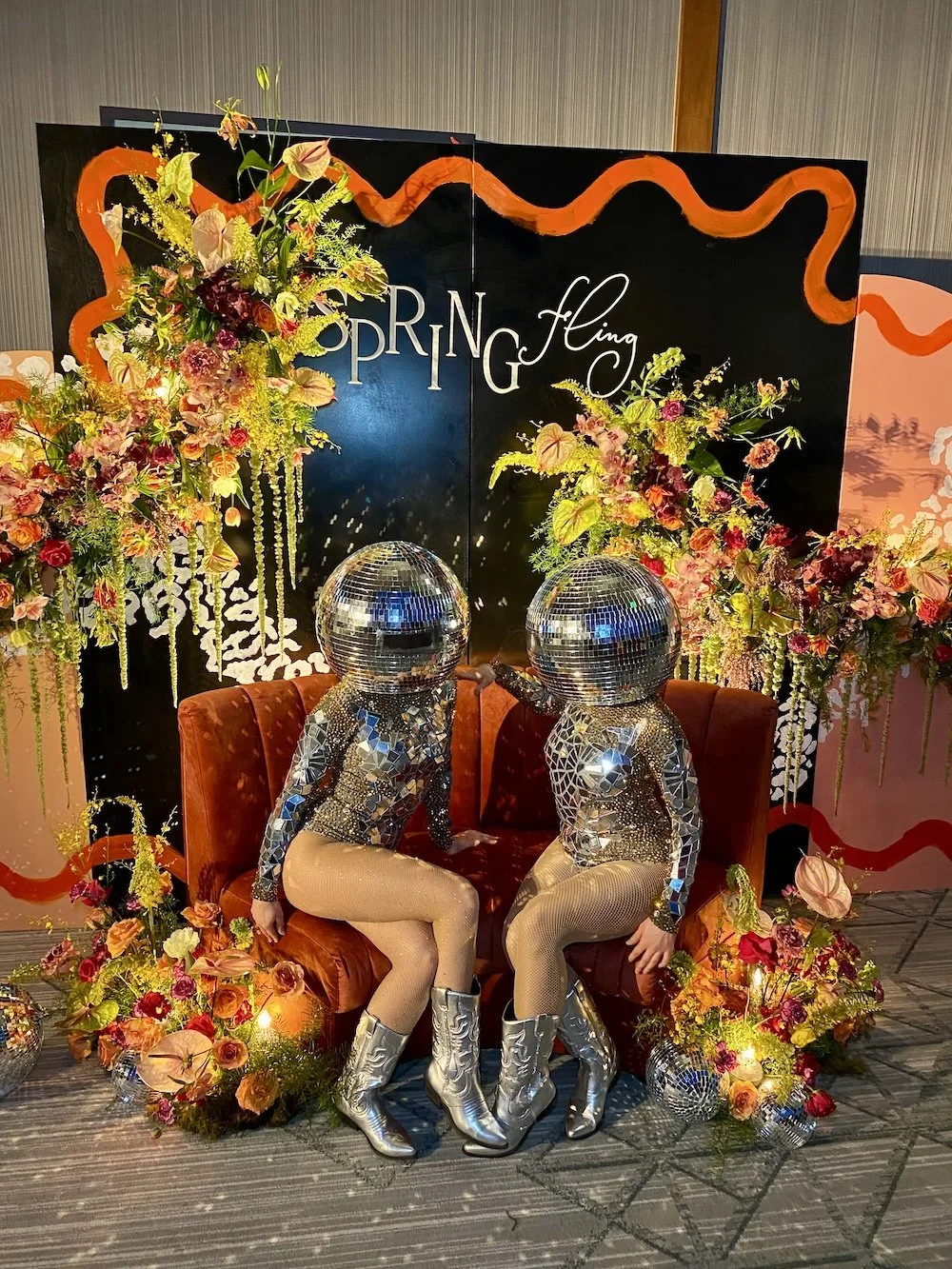 Disco ball cowgirl in boots line dancing at Nashville corporate party