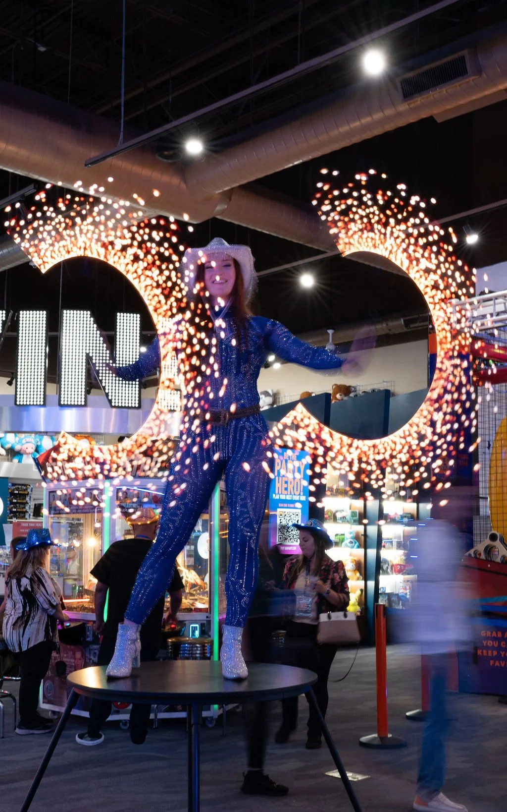 LED poi performer creating colorful light patterns during a Nashville-themed corporate event.