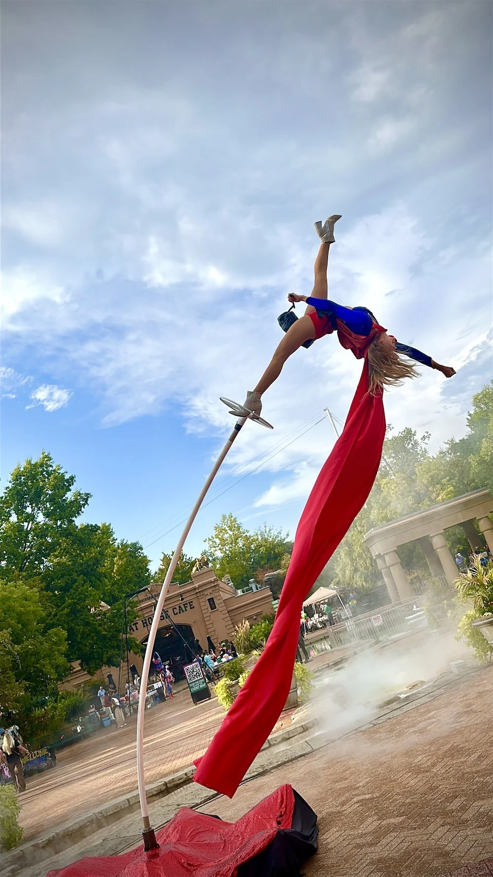 Sway Pole Performer Costumed as Supergirl