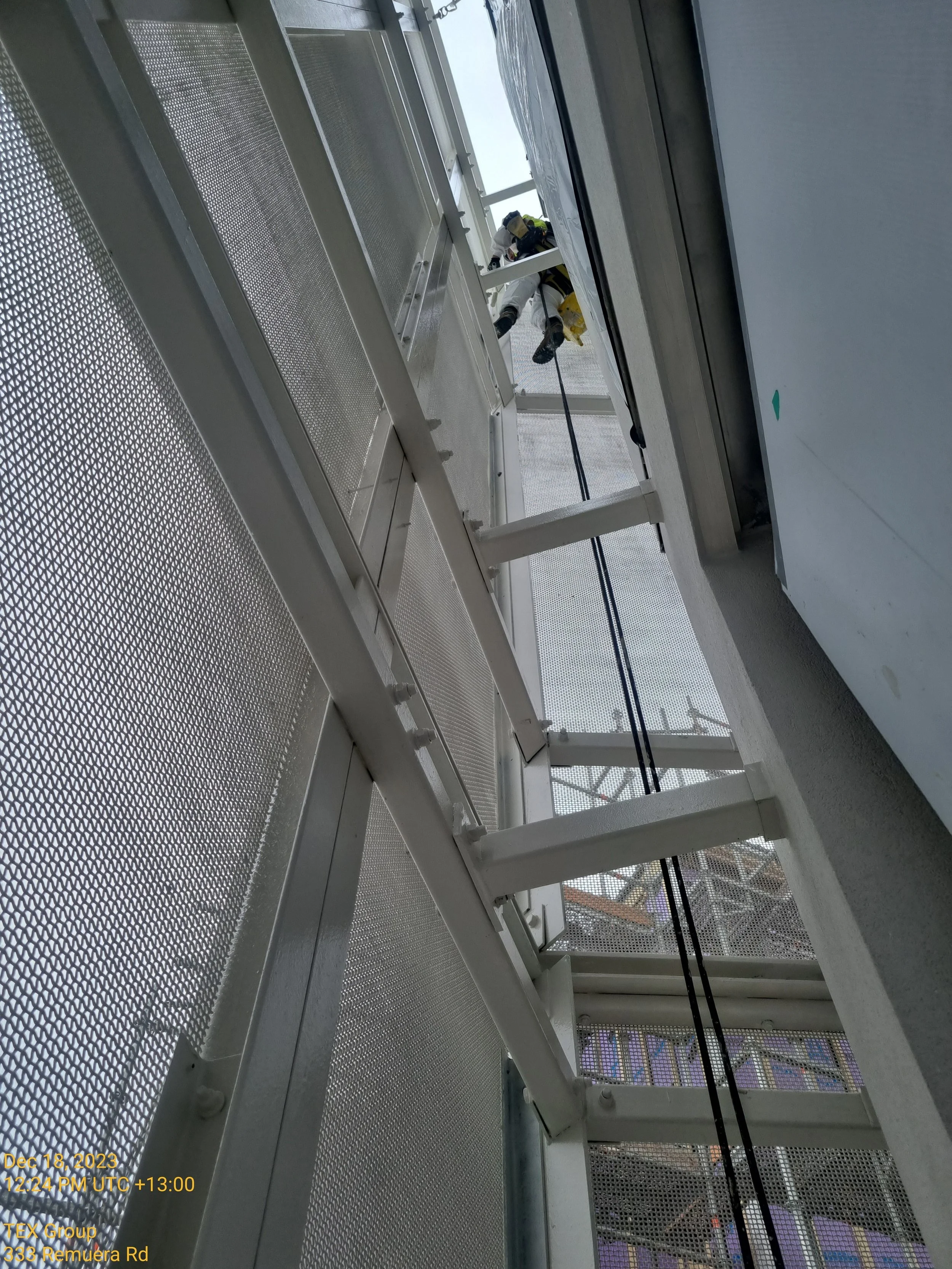 A blueMEWP inside an industrial or warehouse ceiling.