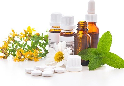 Herbal tinctures, fresh herbs, chamomile flowers and supplements used in naturopathic medicine