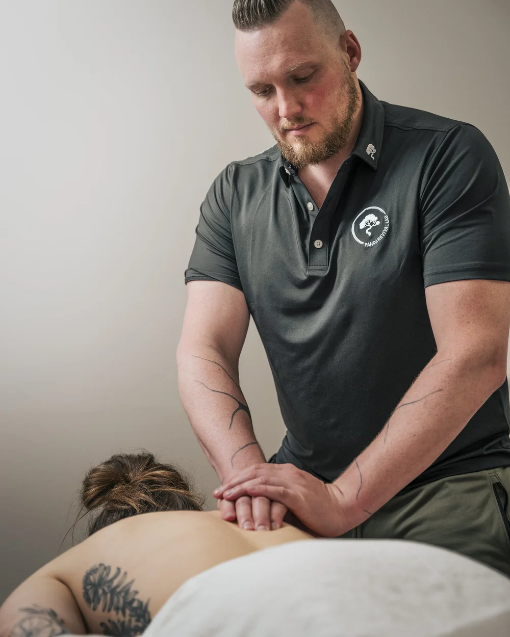Registered massage therapist treating a client at Panda Revival Lab in Surrey