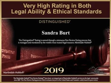 Certificate awarded to Sandra Burt in 2019 for high rating in legal ability and ethical standards by Martindale-Hubbell, featuring a gavel and dark background.