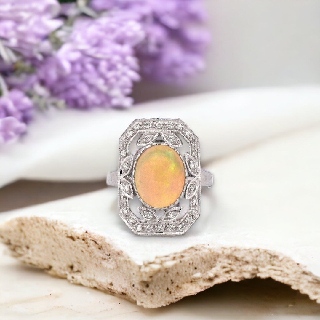 October is all about embracing the enchanting beauty of opals, and we've got a mesmerizing piece to make your heart flutter. Presenting our bespoke diamond and opal ring, a true epitome of grace and elegance in 18k white gold. 💎💫

In the spotlight,