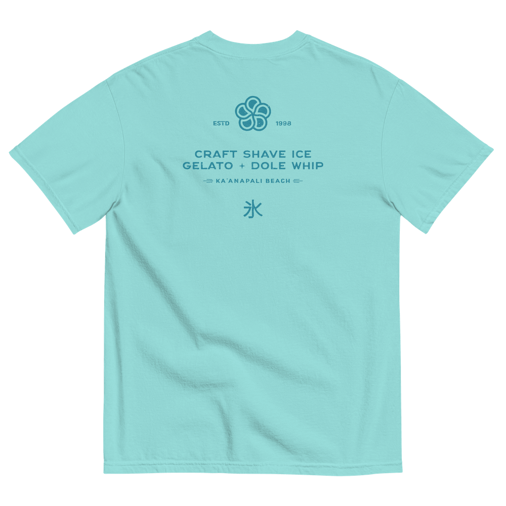 The back of a Caribbean blue t-shirt with the HulaScoops flower mark above the text “Craft Shave Ice, Gelato and Dole Whip” and the Japanese symbol for kakigori all printed in a darker blue color.