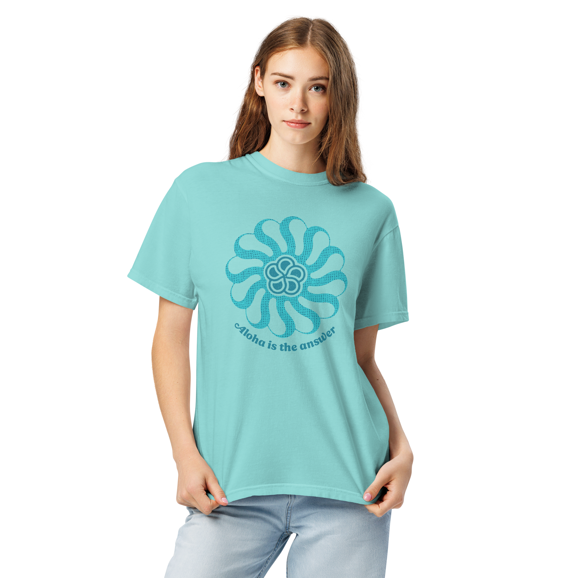 A young female model wears an aqua blue tee-shirt printed with "Aloha is the Answer" and a graphic on the front in two shades of blue.