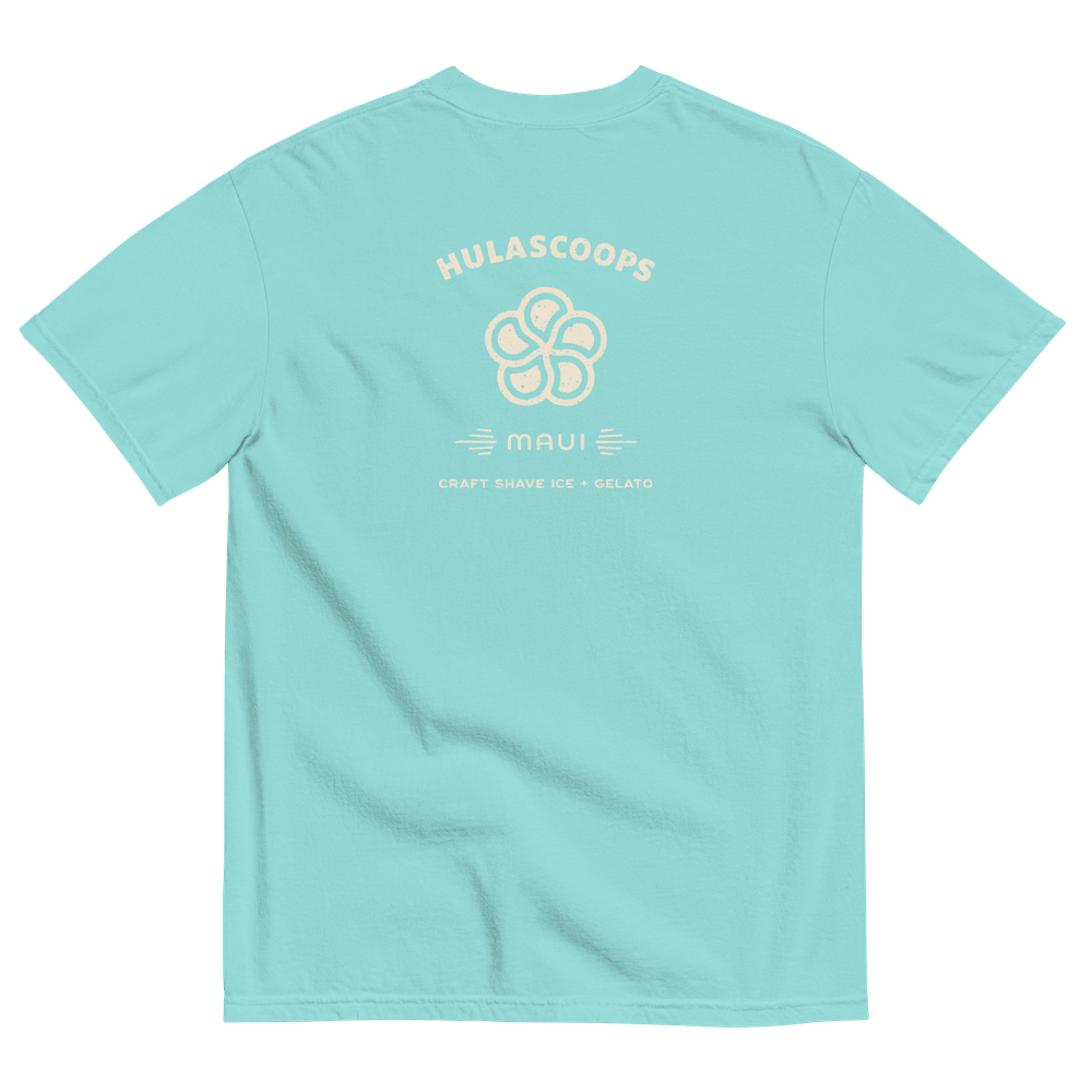 The back of a laguna blue teeshirt with the HulaScoops name and mark above the word “Maui” and the phrase “Craft Shave Ice and Gelato” in pale yellow lettering.