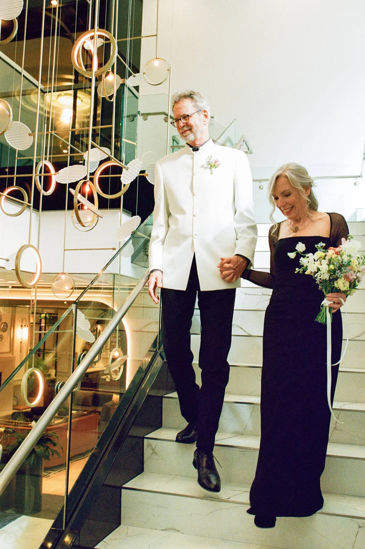 UMMA-Wedding-Couple-Walking-Down-Stairs.jpg