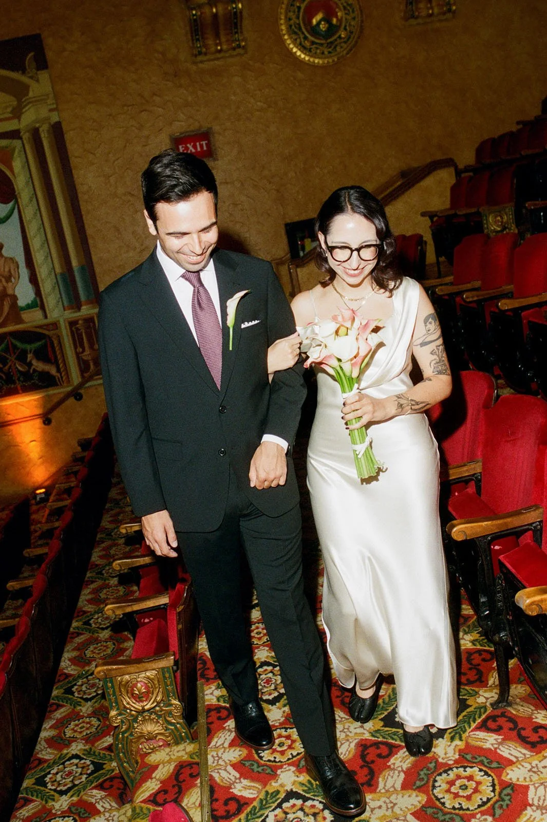 Gem-Theater-Wedding-Bride-and-Groom-Walking.jpg