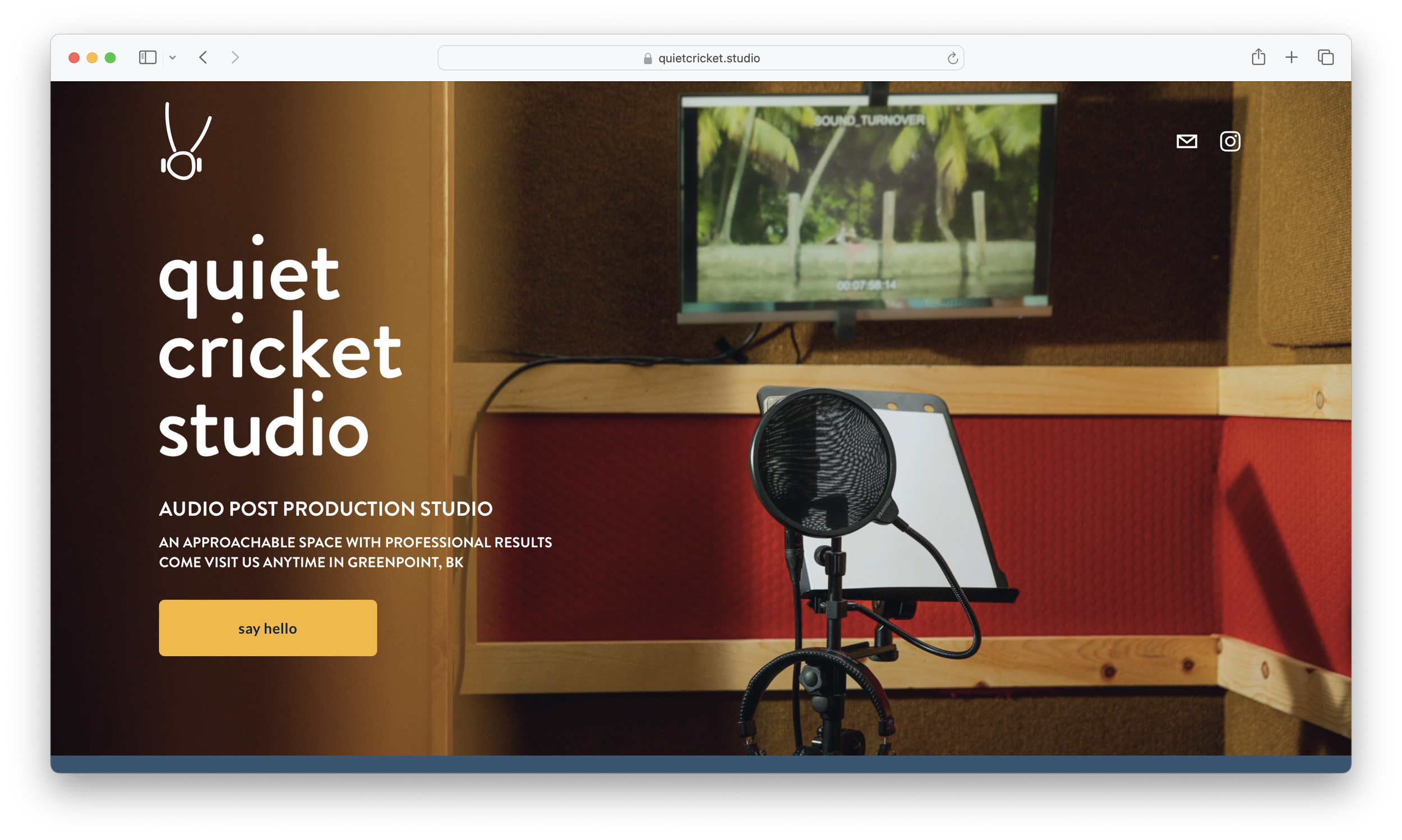 Screenshot of homepage for Quiet Cricket Studio, an audio post production studio, with an image of a microphone, laptop, and screen.