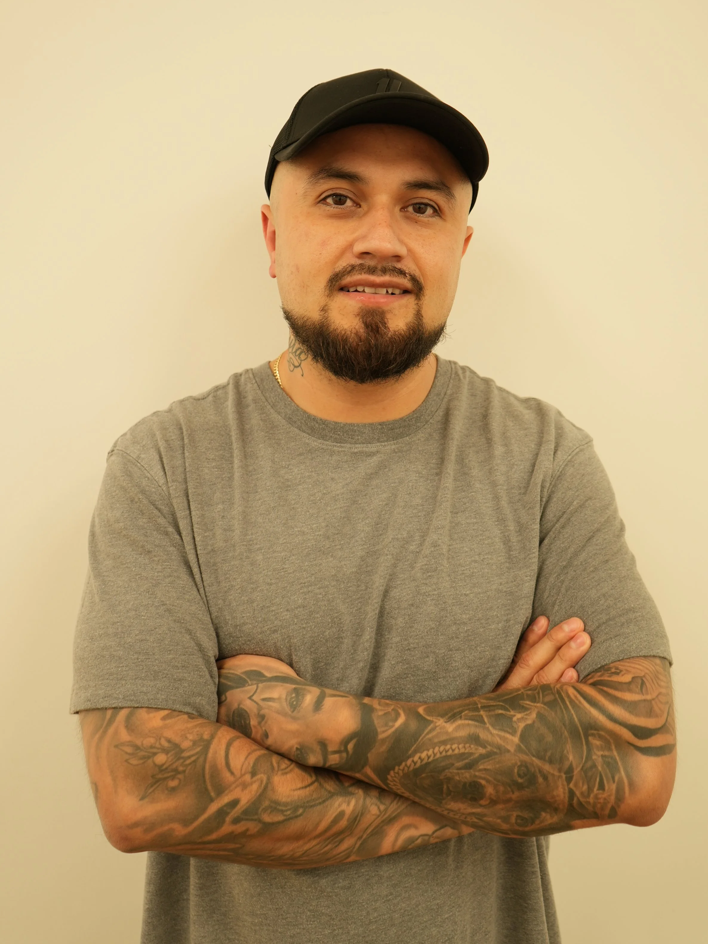 Portrait of a Daniel Sanchez, a tattoo artist and the owner of Ink Source Tattoo Studio.