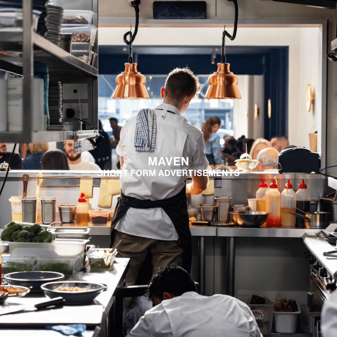 a chef cooking in a commercial kitchen overlooking the restaurant