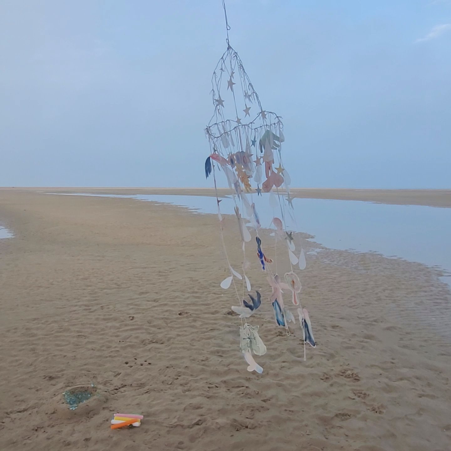 Cocoon. 2023. Installation made from paper, wire, cotton thread and fabric ornaments, candles and marbles