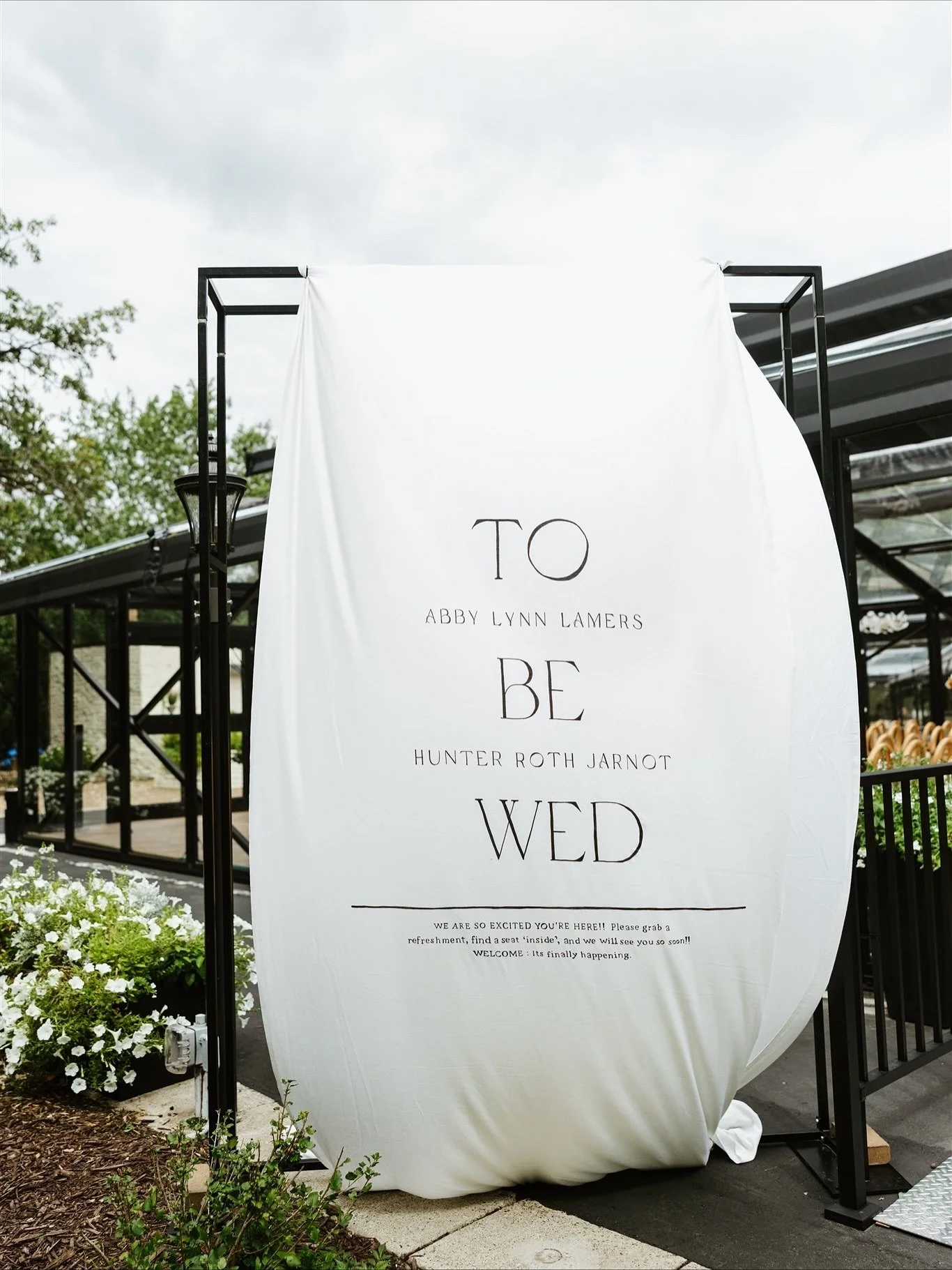 Behind every massive outdoor welcome sign is a planner, dying on the inside, holding bricks, tape, and zipties to get it to stay put 😂 😂 We could not stop laughing at this thing- worth the stress to get it to stay but you better believe that we wer
