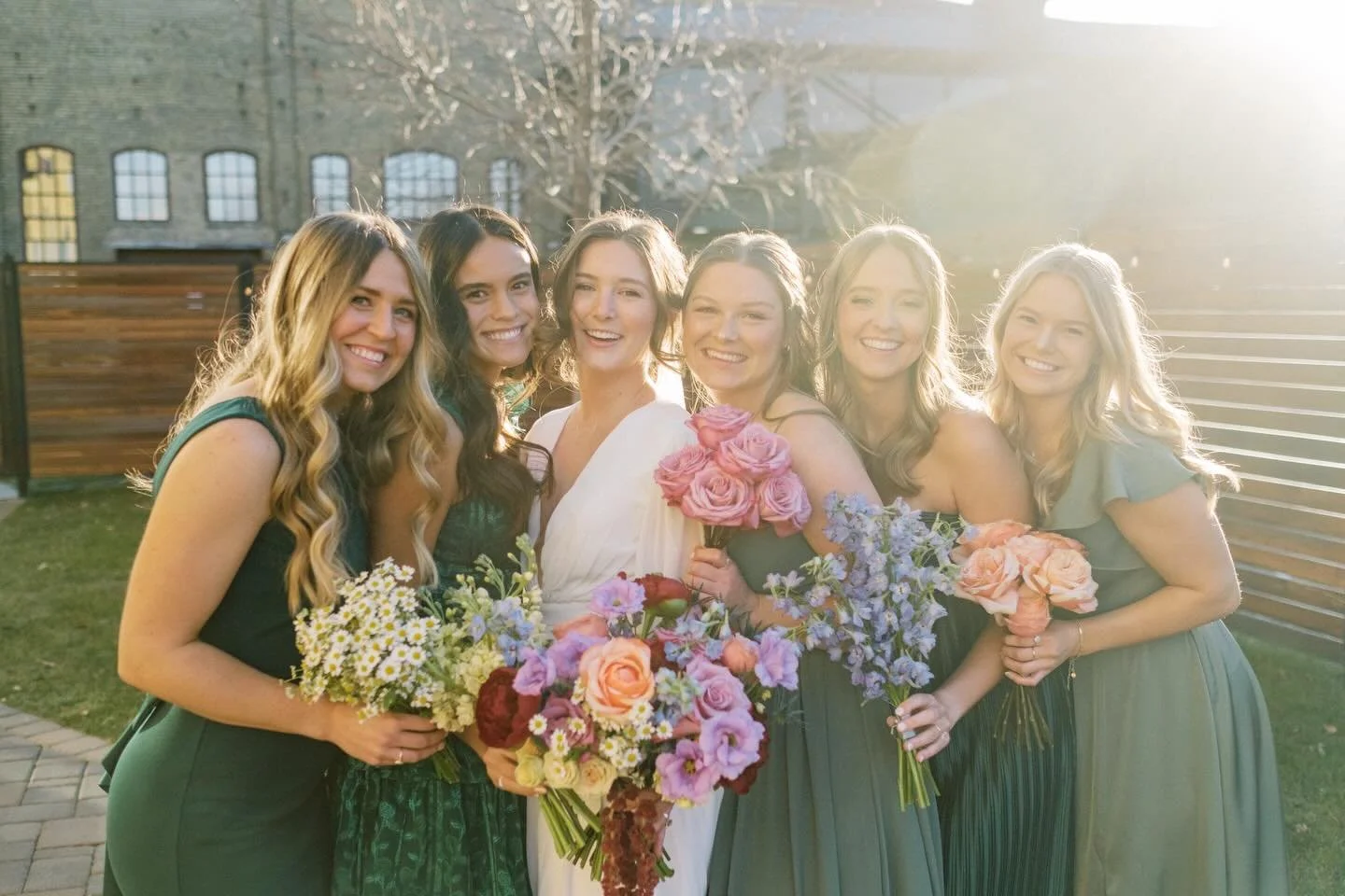 How it feels to have your favorite people by your side- bright, fun, and a nice warm hug from the sun ☀️ 
⠀⠀⠀⠀⠀⠀⠀⠀⠀
We loved bringing this vision to life with each bridesmaid having a bouquet of single stems making up what was in the Brides bouquet ?