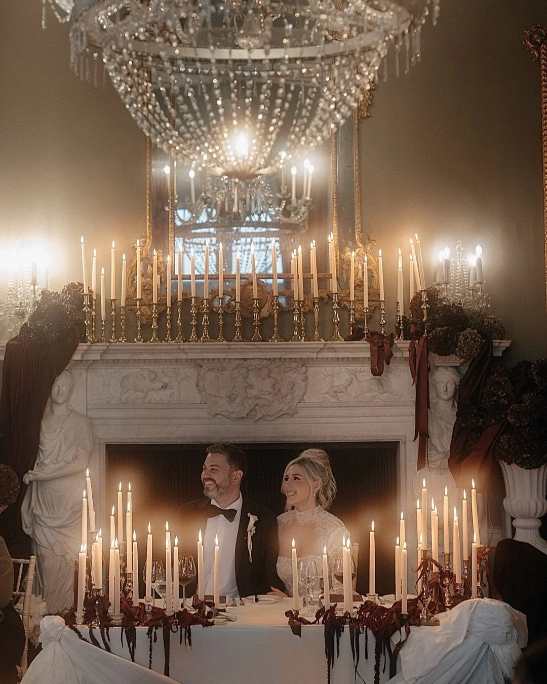 There is something almost hypnotic about candlelight at a wedding. It softens every edge, enriches the colours in the room, and creates an atmosphere that feels both intimate and cinematic. Hundreds of tiny flames can transform a space, turning a gra