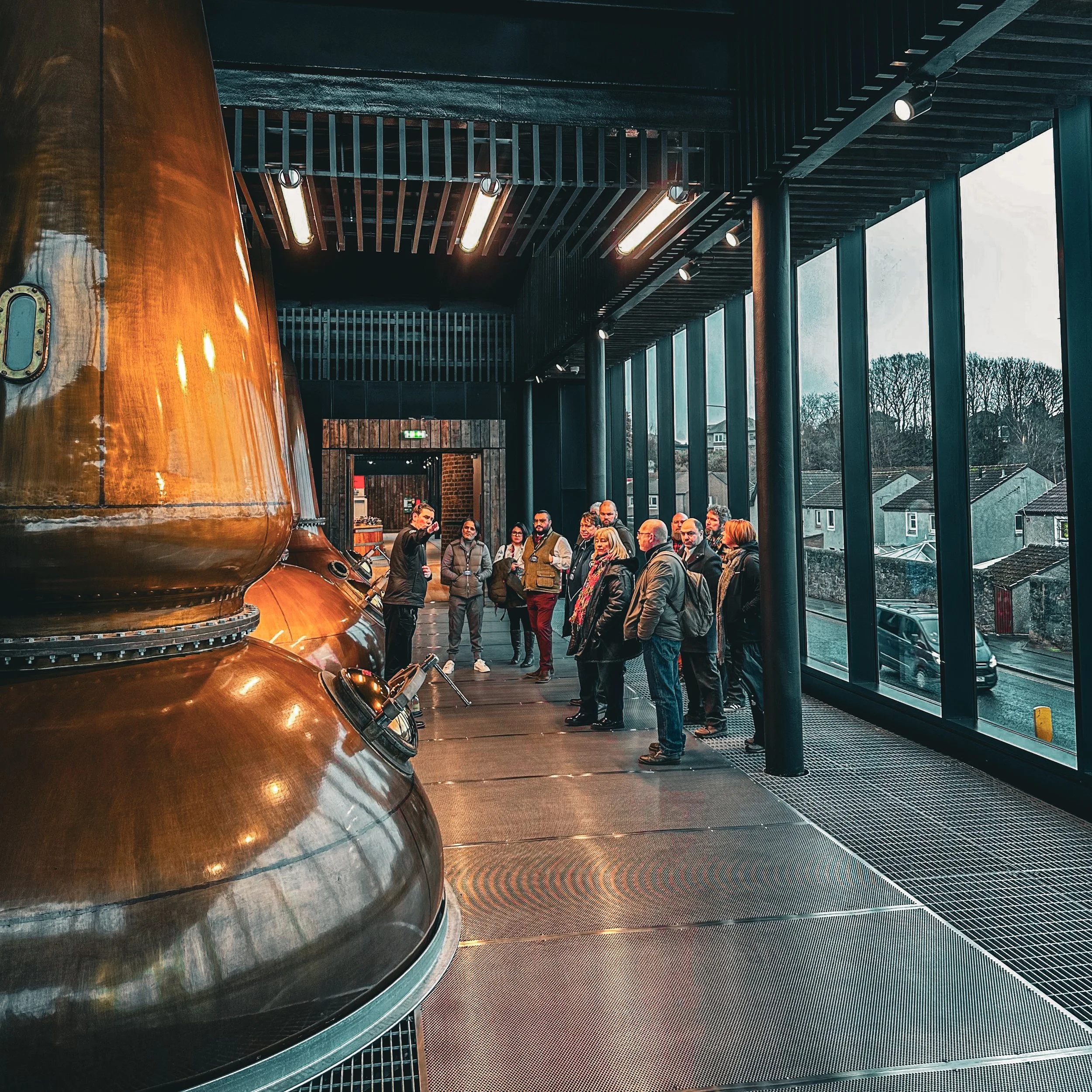 A group of people on a scotch whisky tour