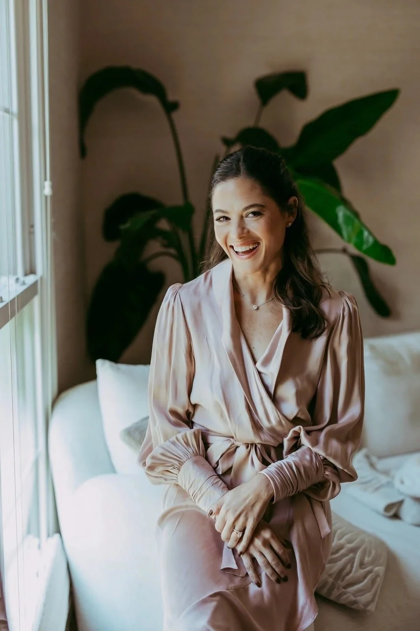 Alana Kessler MS, RDN -  Emotional Eating Coach - Smiling in living room helping patients recover