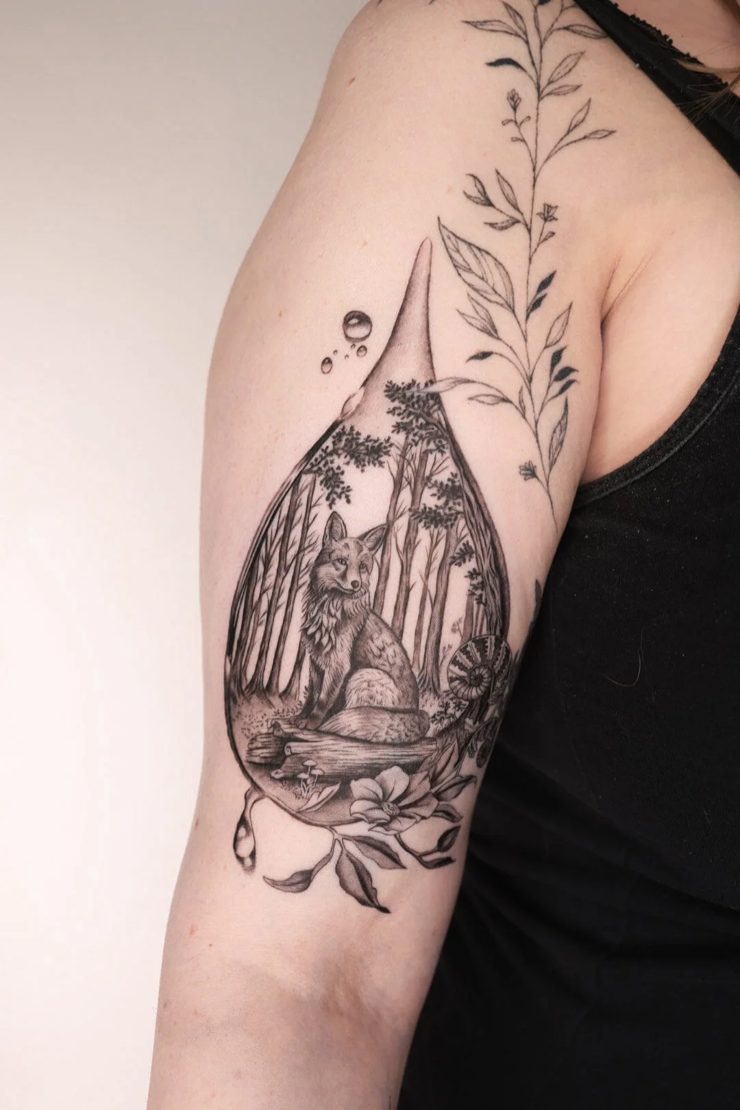 Fox in the forest in the rain drop tattoo