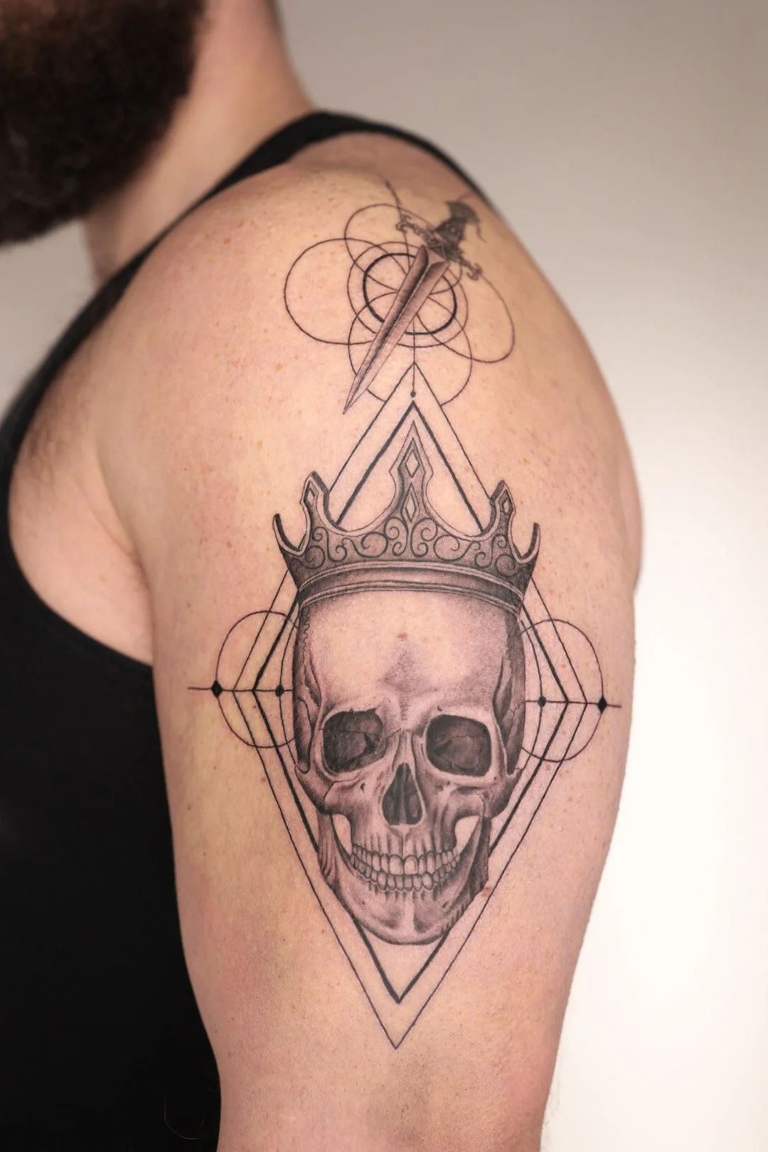 Skeleton and crown tattoo