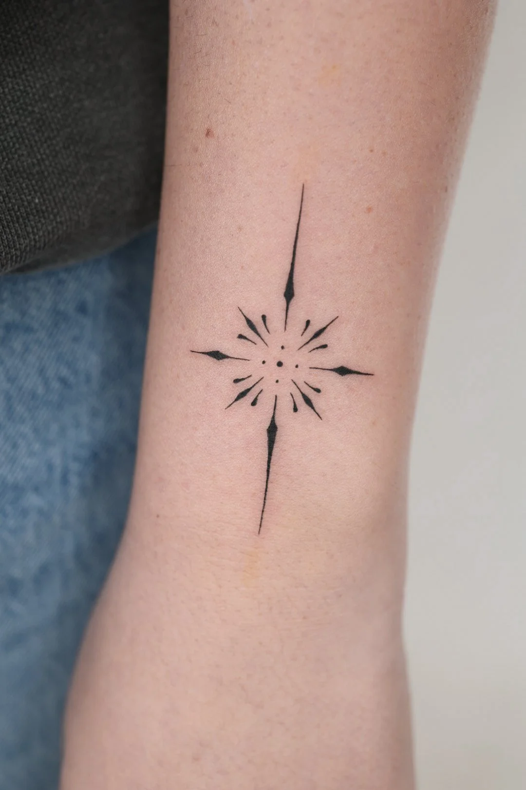Small ornemental wrist tattoo
