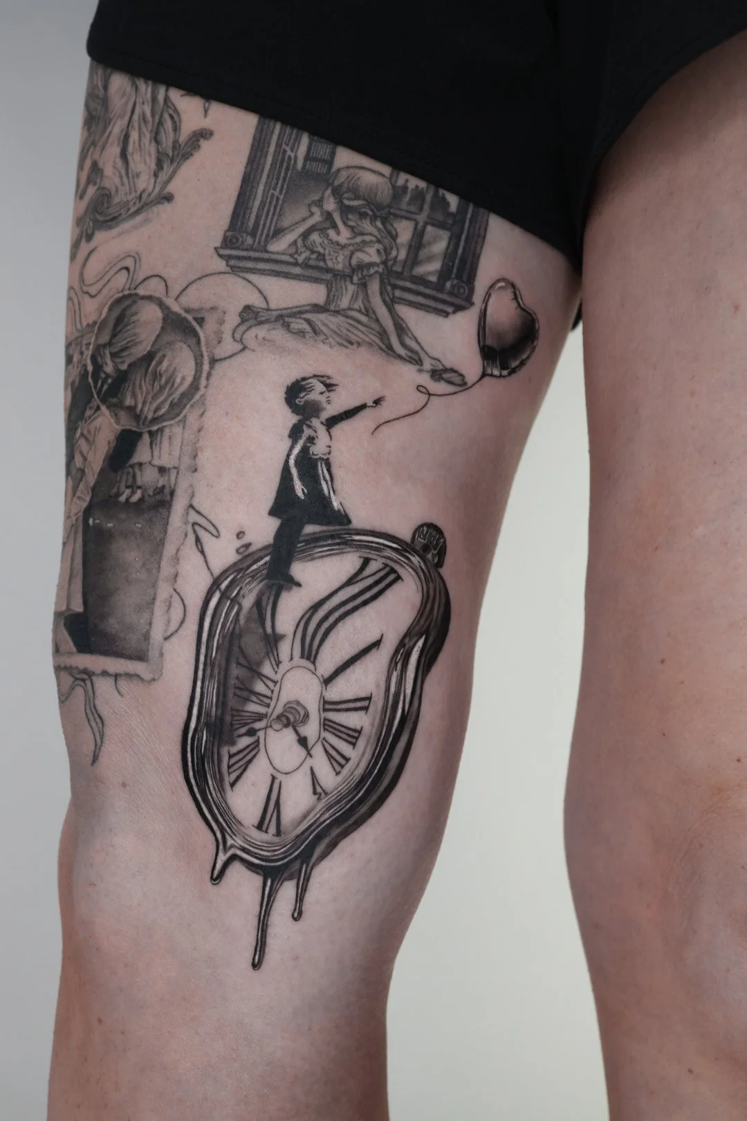 Banksy girl and balloon standing on a melting clock tattoo