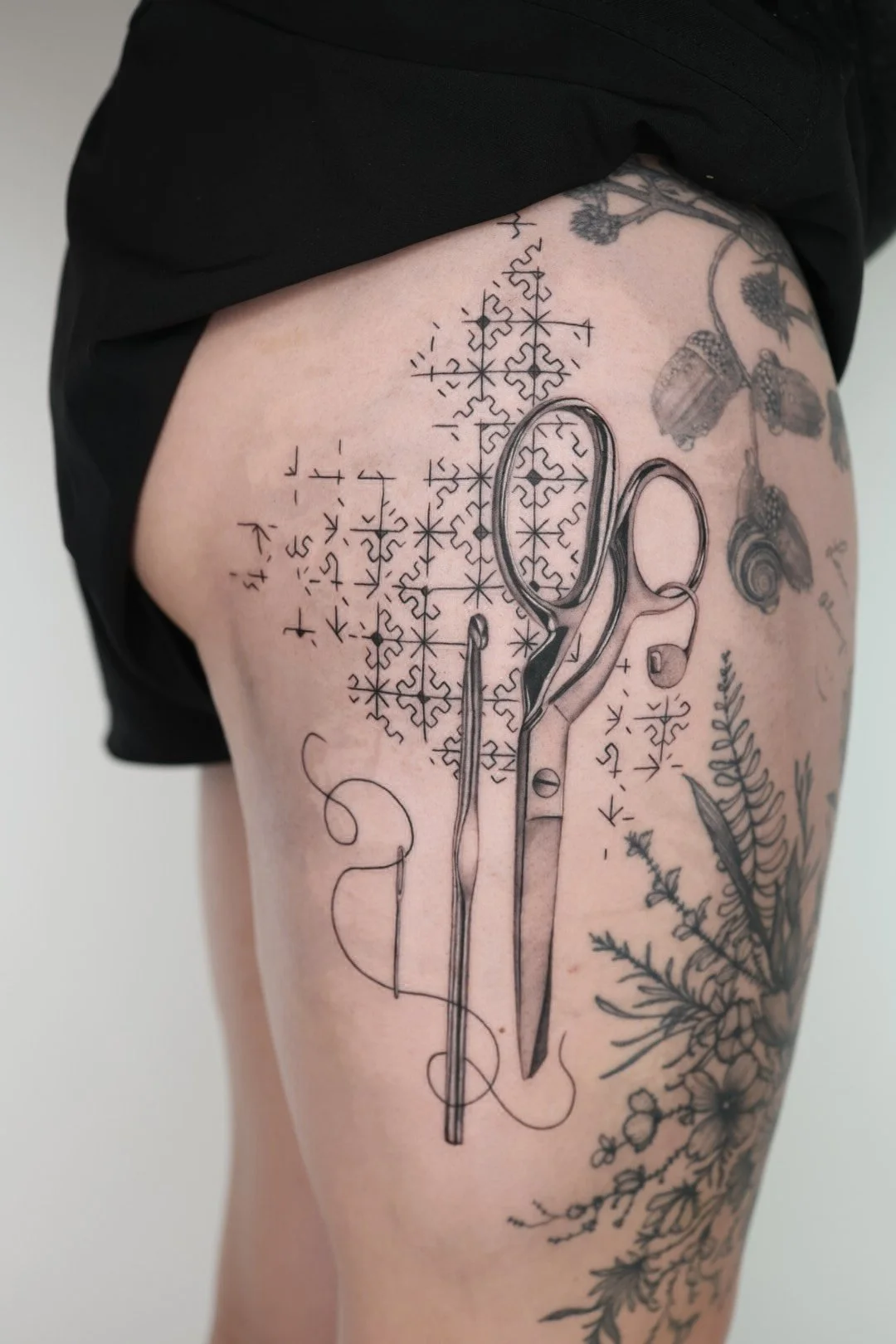 Crochet and sewing conceptual tattoo