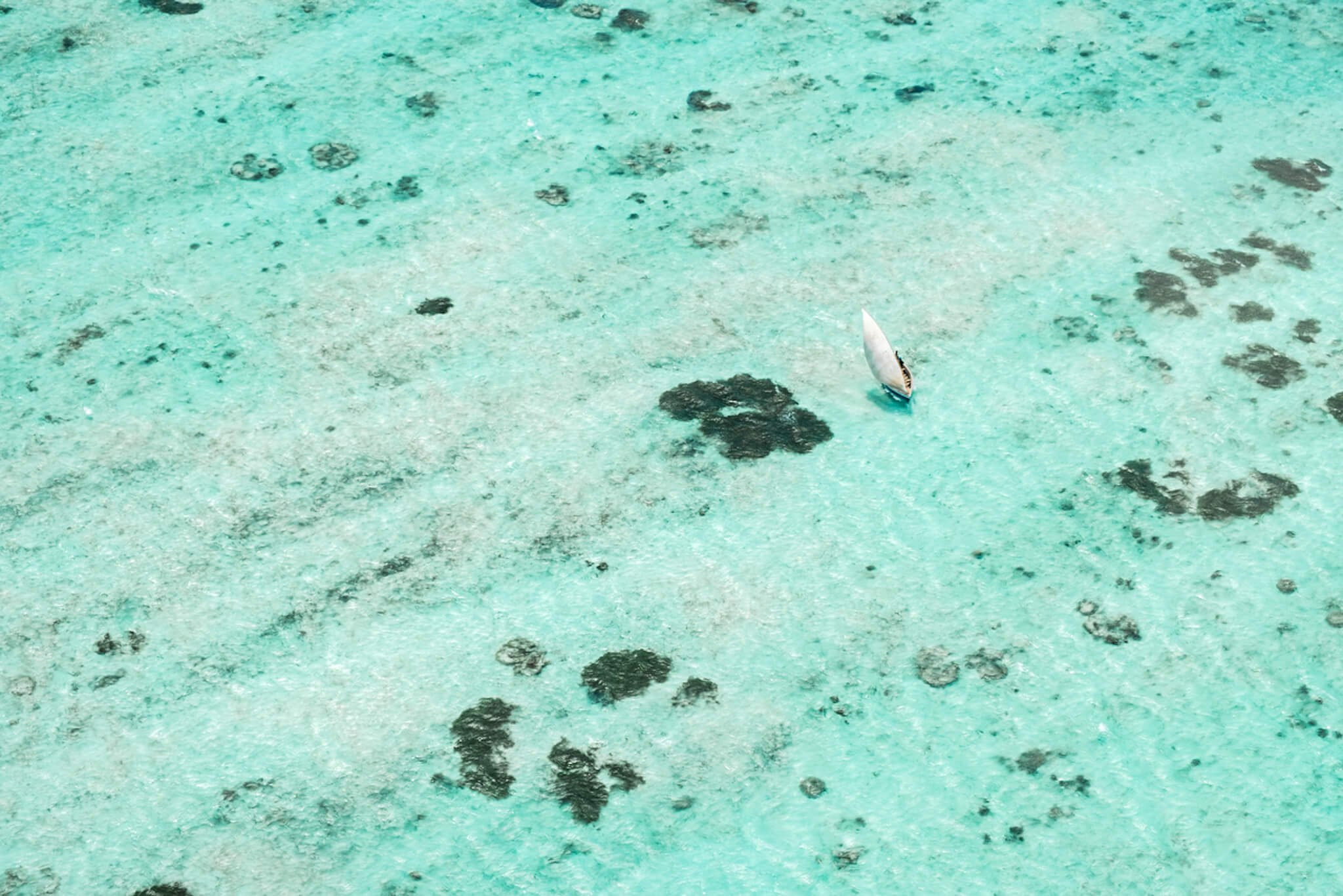 Madagascar beach and sailboat.