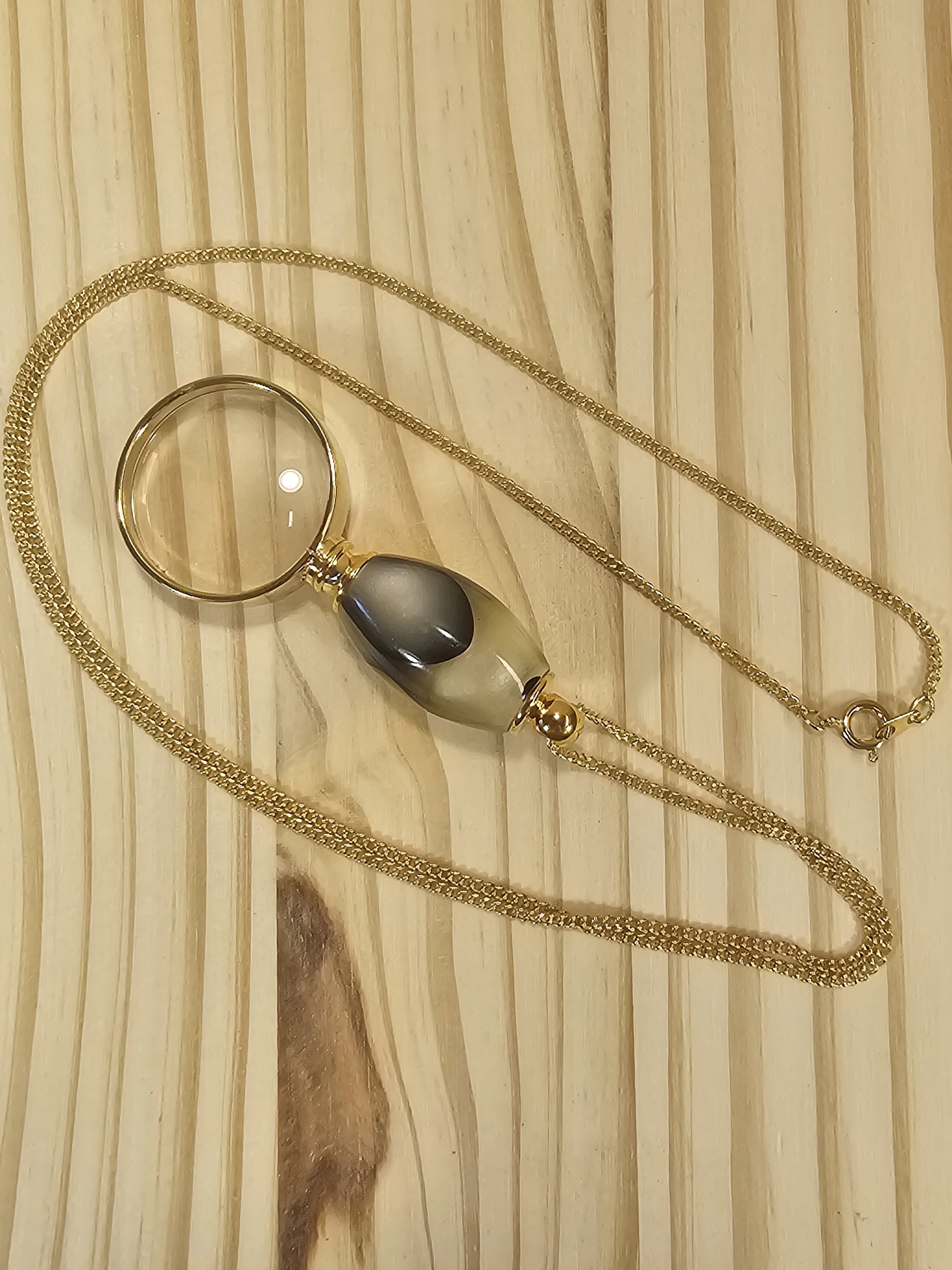 Magnifying Glass Pendant with Swirled White Pearl & Black polyresin