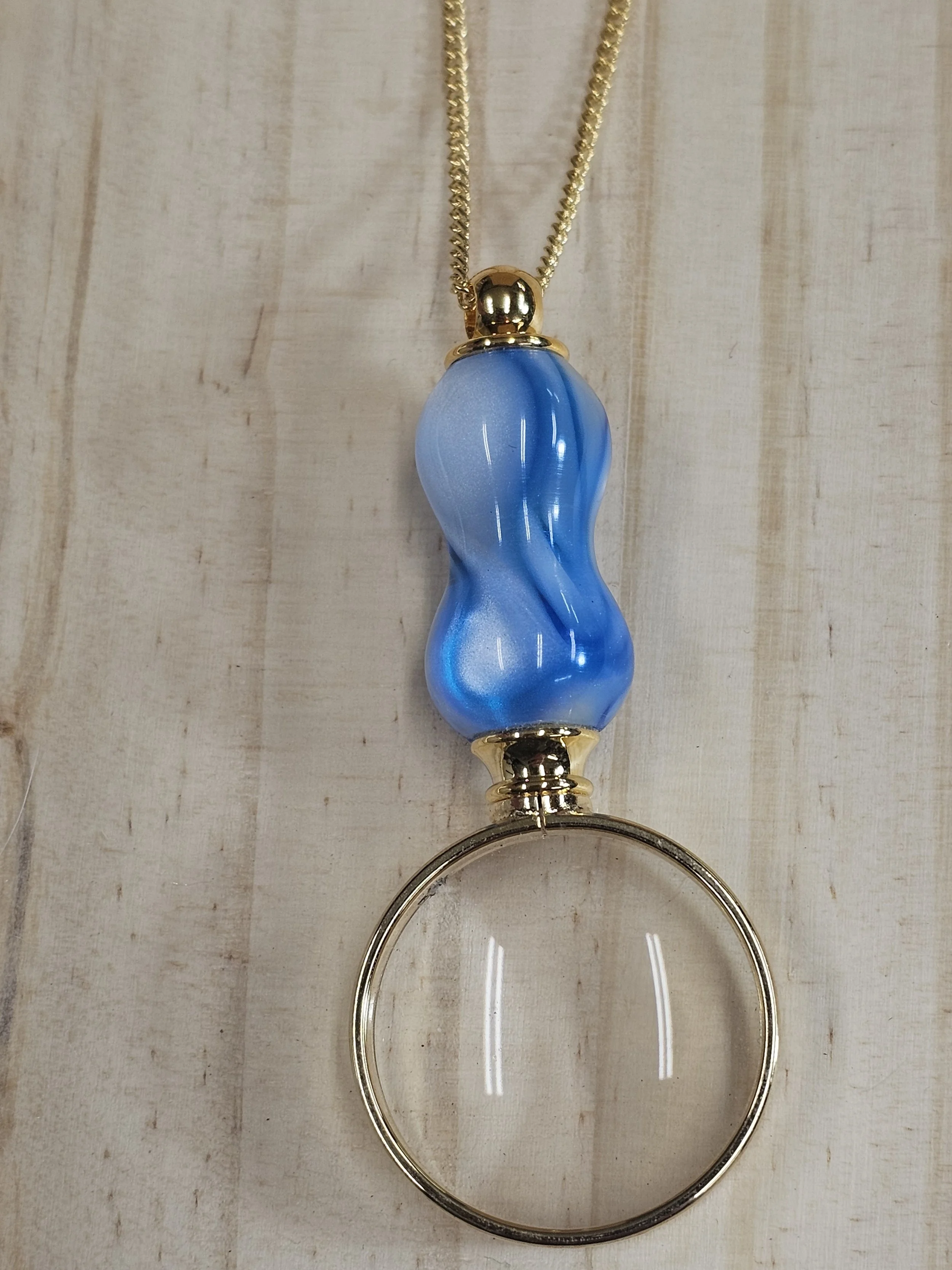 Magnifying Glass Pendant with icy white and blue polyresin