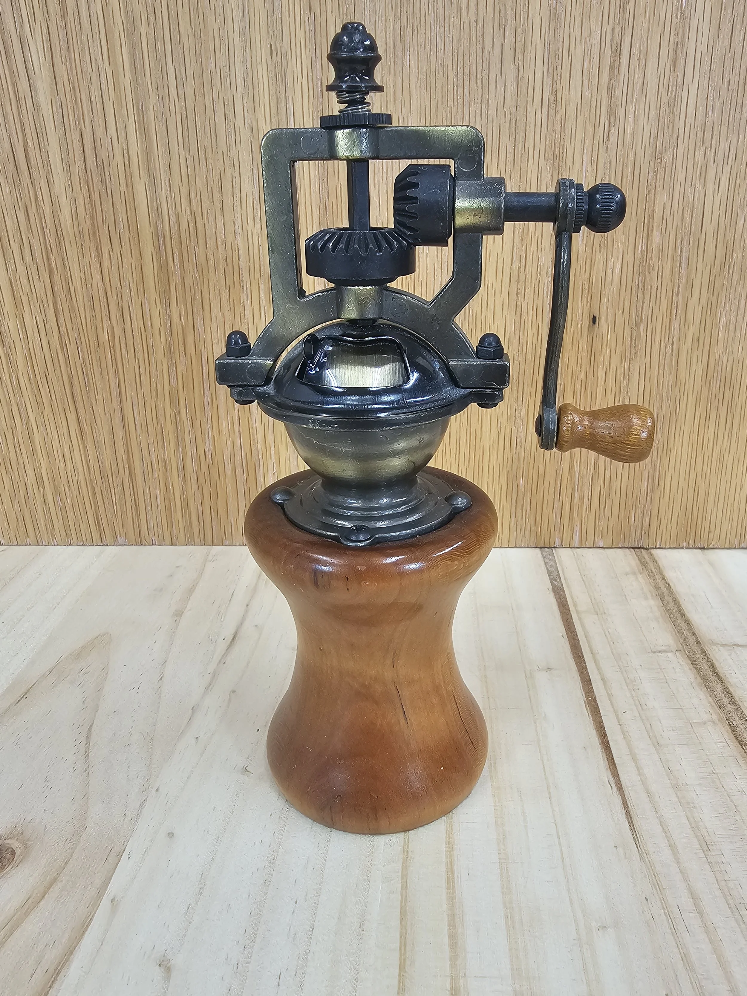 Steampunk pepper grinder made of light mahogany