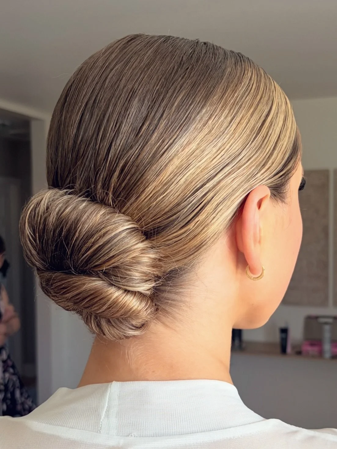Nothing like a clean, tight, low knot for a sophisticated bride💕#bridalhair #bridalupdo #lowupdo #knottedupdo #blondeupdo